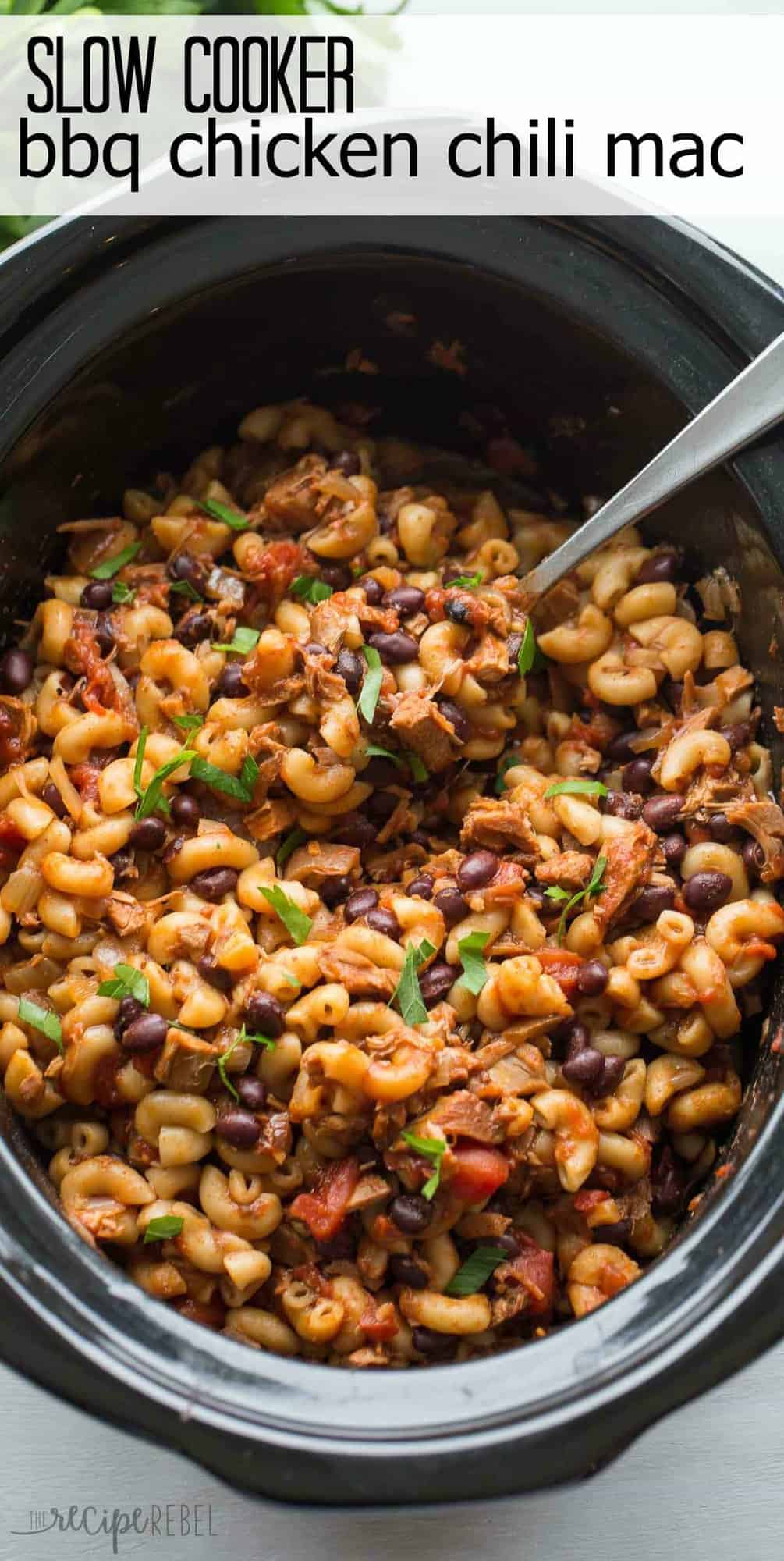 black slow cooker with bbq chicken chili mac and title above image in black