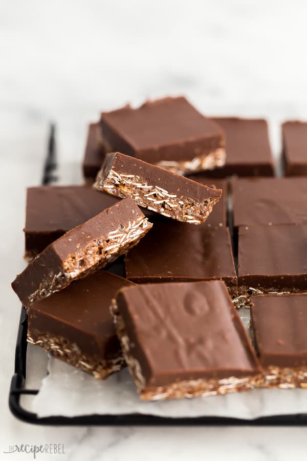 crunch bars in squares on black baking rack