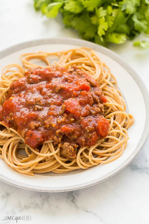 slow cooker spaghetti sauce plated on grey plate on white background