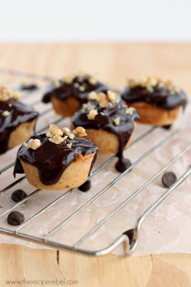 cooling rack with banana blondie bites topped with chocolate ganache and chopped peanuts