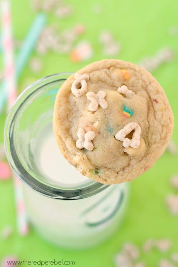 overhead image of lucky charms cookie resting on a glass of milk