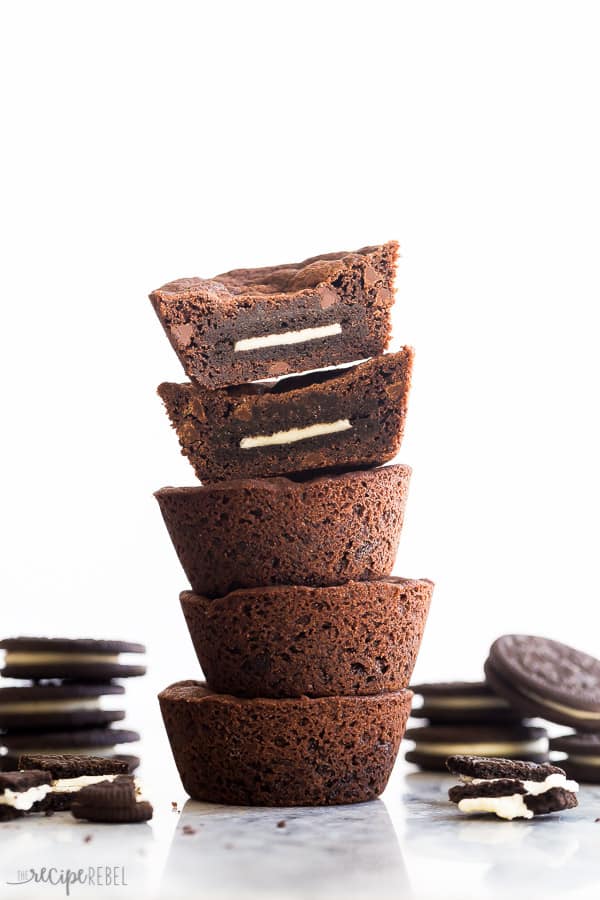 oreo cookie cups stacked with top cookies cut in half to reveal oreo inside