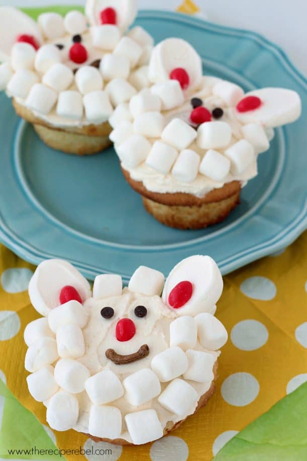 cupcake decorated to look like a lamb on colorful napkins
