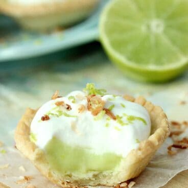 Coconut Lime Tarts: a light, creamy and refreshing lime filling topped with fluffy coconut cream! Easily dairy free. Perfect for Spring or Cinco de Mayo! www.thereciperebel.com