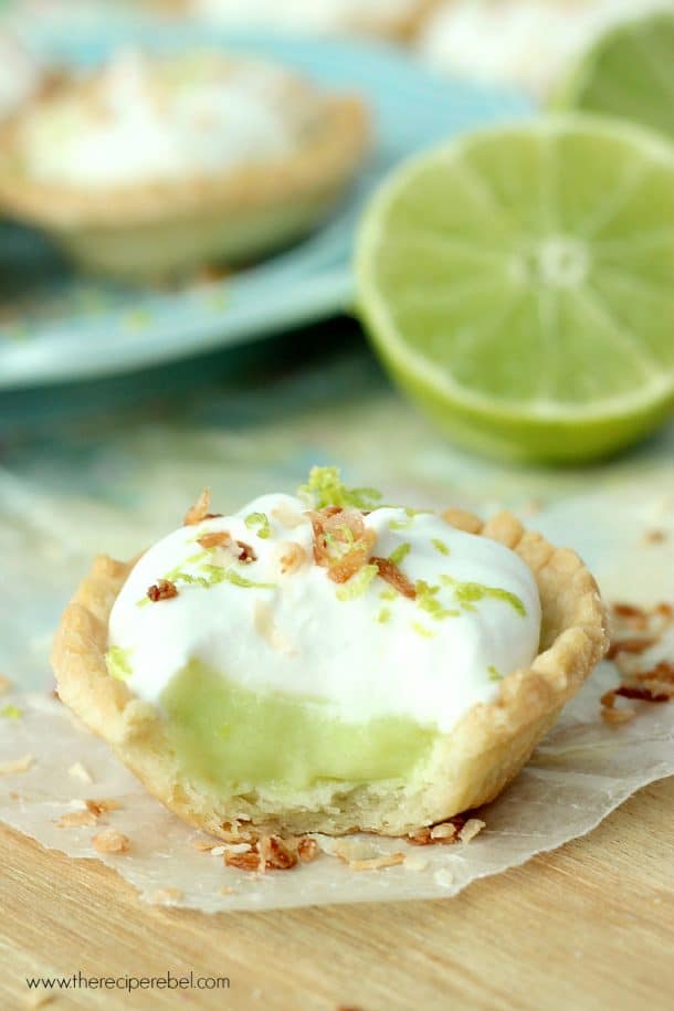 coconut lime tart close up with a bite taken