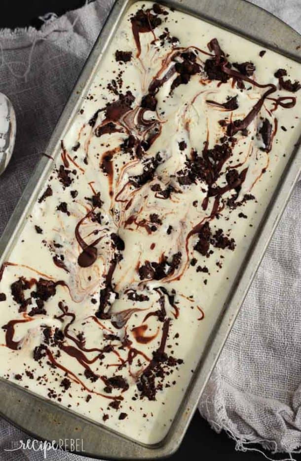overhead image of ice cream with chocolate swirl and oreo crumbs in tin loaf pan