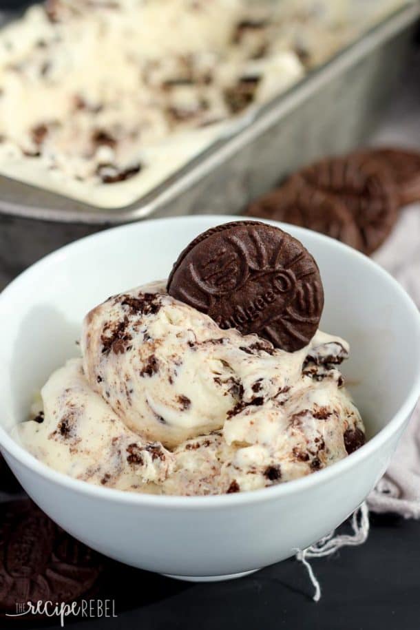 white bowl filled with cookies and cream ice cream and topped with a fudgeeo