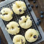 These Baked Lemon Blueberry Doughnuts are fluffy, packed with citrus flavor and bursting with blueberries and covered in a tangy glaze! Baked donuts are the perfect healthy breakfast or snack. Includes step by step recipe video. | baked donuts | lemon recipe | lemon dessert | baking | lemon donuts