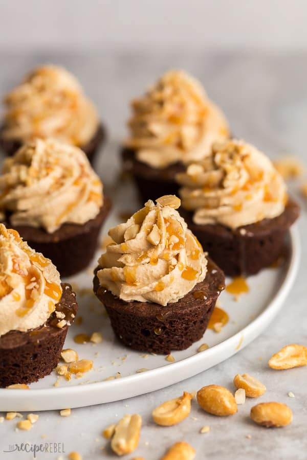 snickers brownie bites on white plate on grey background