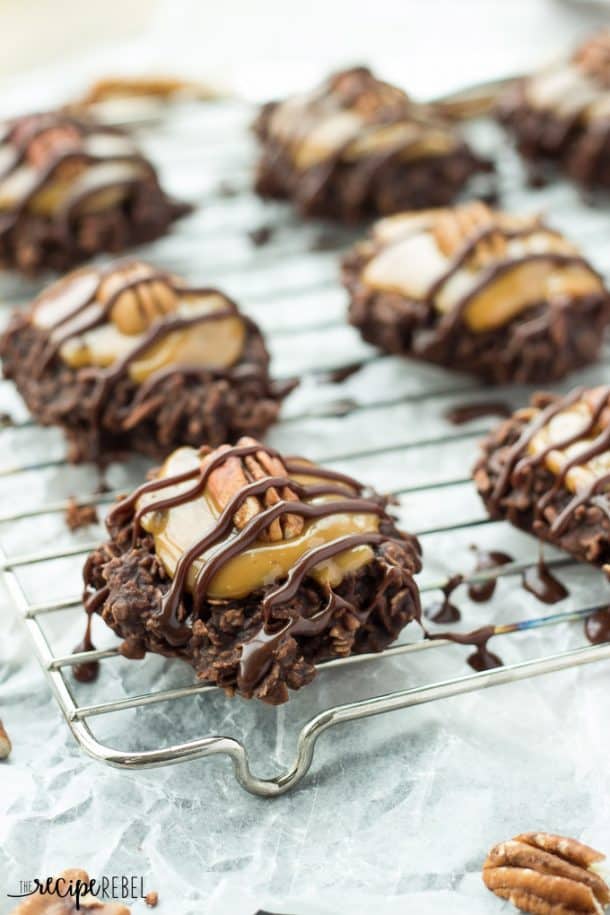 close up image of no bake turtle cookies with caramel pecans and chocolate drizzle