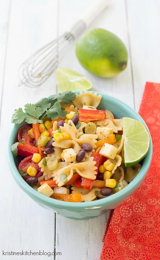 southwestern pasta salad with bowtie pasta and lime wedge on the side