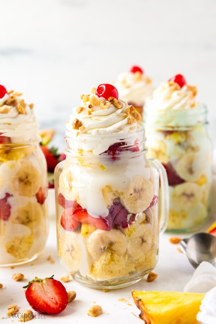 banana split trifle in mason jar with whipped cream