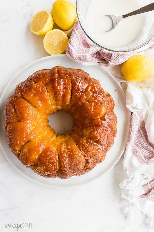 This Glazed Lemon Monkey Bread is made with homemade bun dough rolled in lemon sugar, baked, and covered in a thick lemon glaze. The perfect make ahead breakfast, brunch or dessert! #lemon #bread #breakfast #baking lemon monkey bread overhead