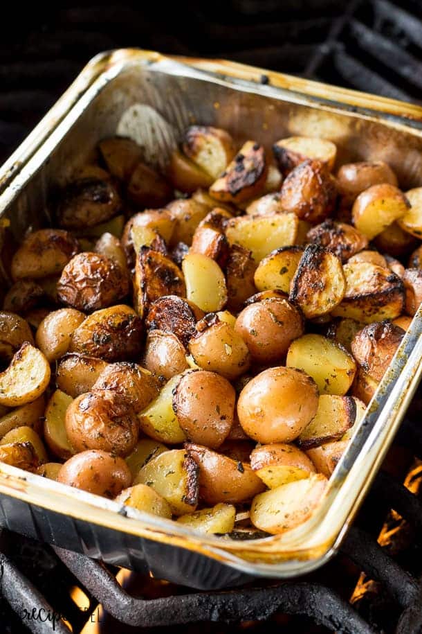 grilled baby potatoes in foil pan on grill