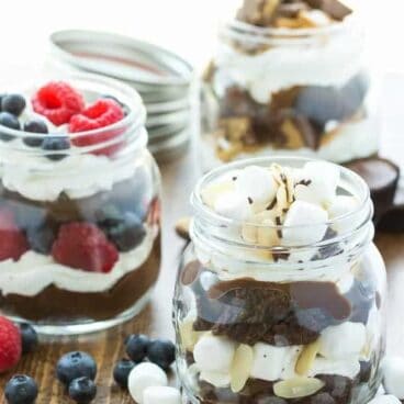 No Bake Brownie Trifle: A simple, no bake summer dessert made 3 different ways: Red, White and Blue Berry, Peanut Butter Cup, and Heavenly Hash! Only 4 main ingredients plus your choice of mix ins! A perfectly portable dessert for picnics. www.thereciperebel.com