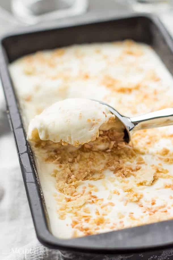 coconut cream pie ice cream in loaf pan with ice cream scoop scooping