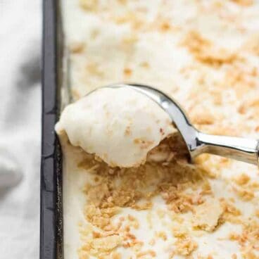 No Churn Coconut Cream Pie Ice Cream: A simple, 8-ingredient ice cream (only 5 if you use store-bought pie crust!) that tastes just like coconut cream pie! An easy, no-bake, no-stove, no-churn, but totally delicious summer treat! www.thereciperebel.com