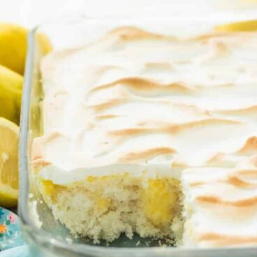 Skinny Lemon Meringue Poke Cake: Starts with a cake mix or scratch vanilla cake, this poke cake is covered in homemade lemon curd (or use store bought for a shortcut) and easy meringue -- a great light dessert for Spring or Summer! www.thereciperebel.com