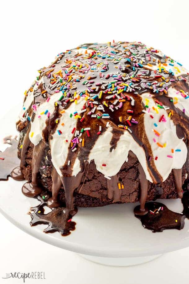 ice cream brownie mountain up close with whipped cream chocolate sauce and sprinkles