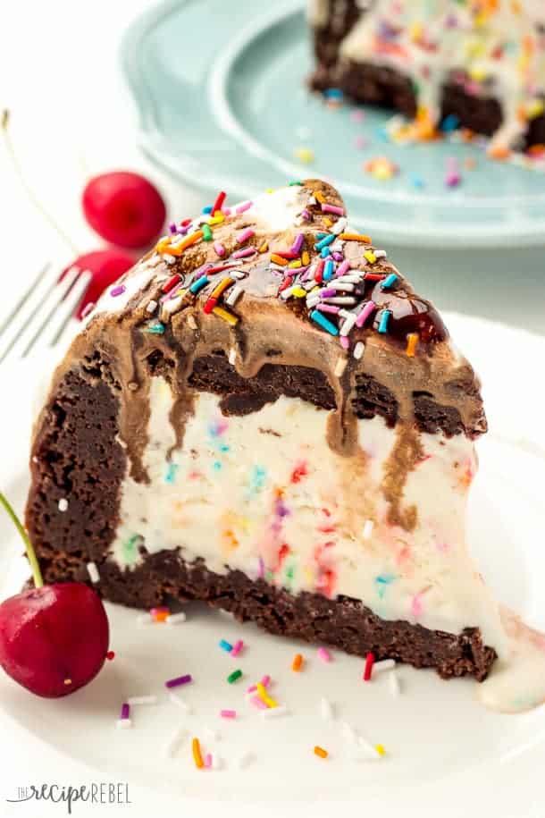 slice of brownie mountain ice cream cake with sprinkle ice cream in the middle and brownies all around