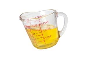 image of a liquid measuring cup with yellow liquid in it