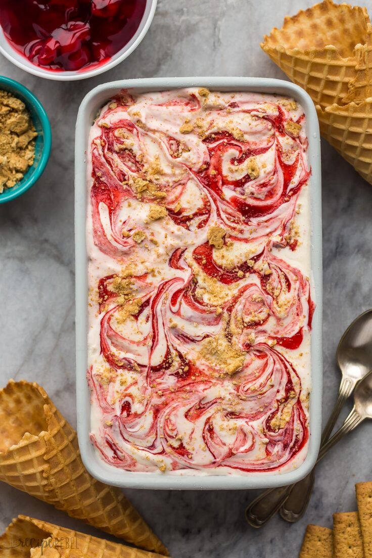 overhead image of loaf pan filled with cherry cheesecake ice cream