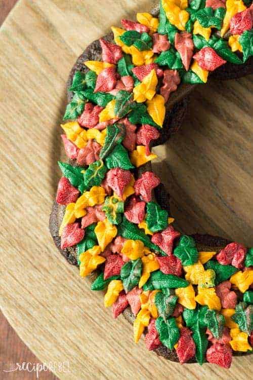 overhead close up of half of fall wreath with frosting in fall colors of green red and yellow