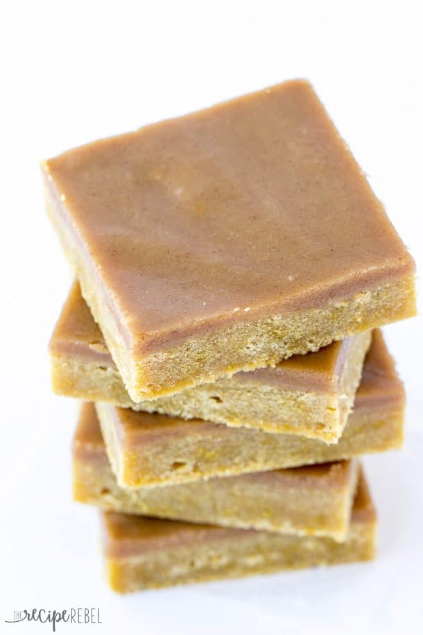 close up image of top of stack of blondies on white background