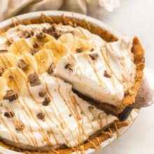 slice of banana cream pie being lifted out of pan