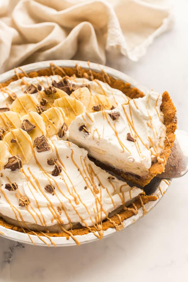 slice of banana cream pie being lifted out of pan