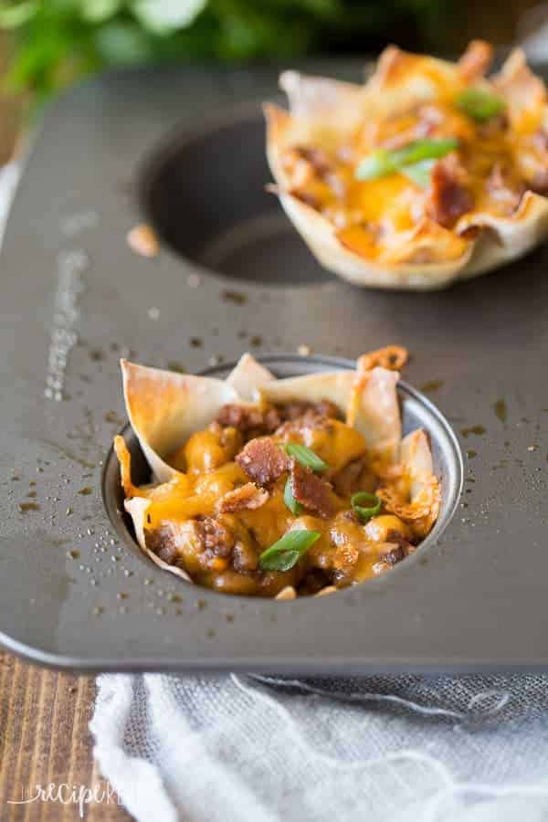 Bacon, beef, barbecue sauce and cheese stuffed into a wonton wrapper and baked until crispy -- the perfect finger food for game day or any party! bbq bacon cheeseburger cupcakes in non stick muffin pan