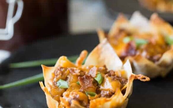 Bacon, beef, barbecue sauce and cheese stuffed into a wonton wrapper and baked until crispy -- the perfect finger food for game day or any party!