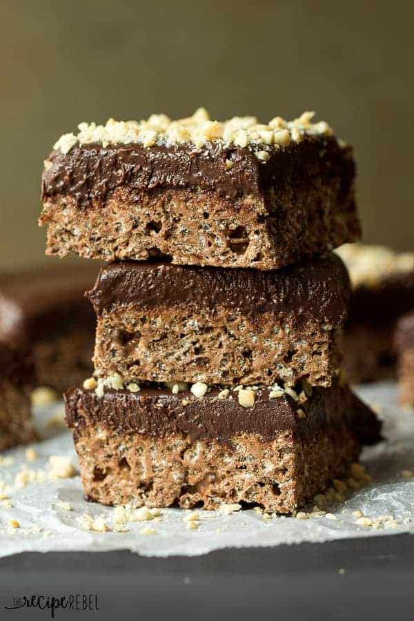 stack of three chocolate truffle rice krispie treats topped with chopped peanuts