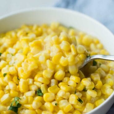 This Slow Cooker Creamed Corn is so easy -- just mix it together and throw it in! It has no cream and is a healthier, dairy free option that tastes just as good!