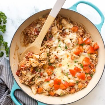 caprese chicken and rice overhead with scoop