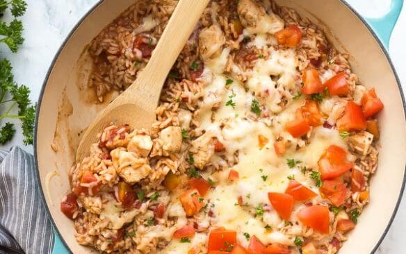 caprese chicken and rice overhead with scoop