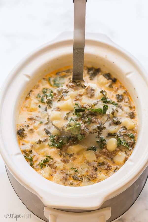 slow cooker zuppa toscana in metal ladle