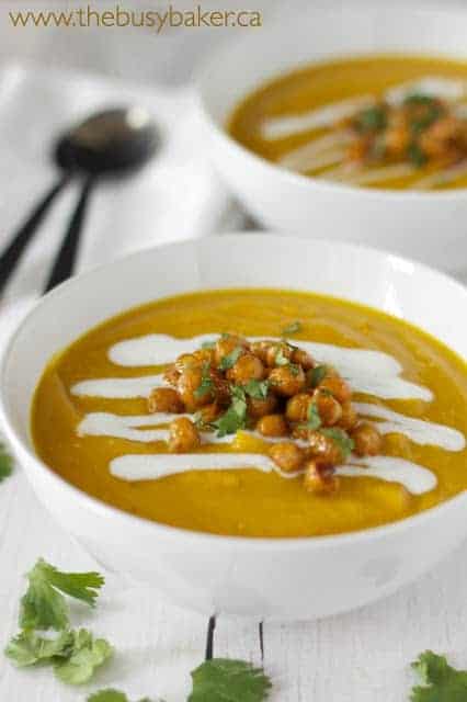 butternut squash red lentil soup in white bowl with crispy chickpeas