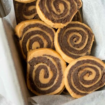 These no bake Chocolate Peanut Butter Pinwheels are easy with only 3 ingredients! They are made up of two layers of fudge, rolled together into a pinwheel shape!