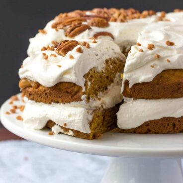 A moist, pumpkin spice cake layered with thick caramel, pecans, and whipped cream -- the perfect holiday dessert!