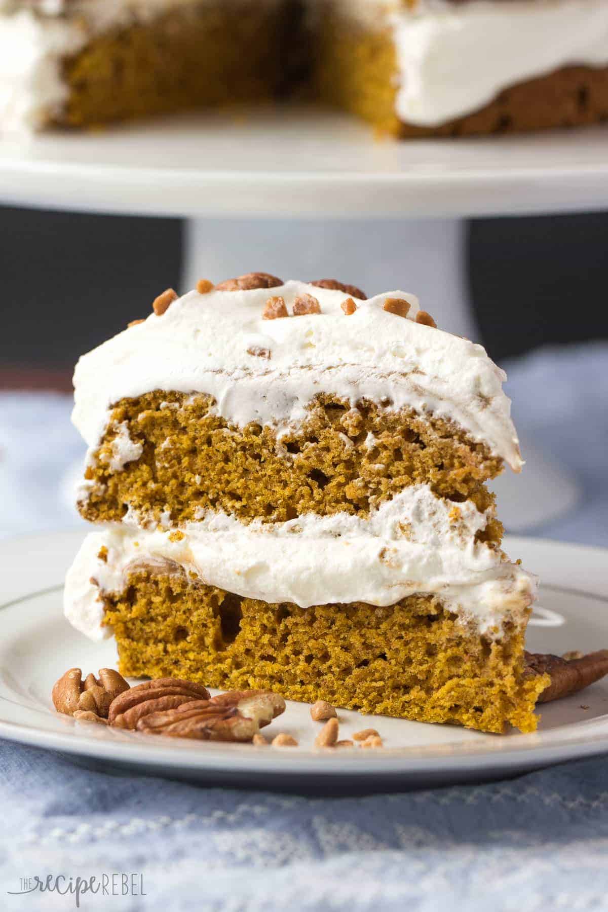 slice of pumpkin caramel naked cake on white plate with pecans on the side