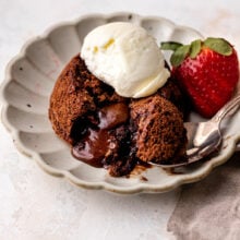lava cake cut open with ice cream on top.