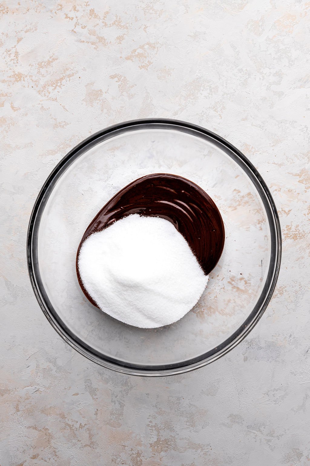 melted chocolate and sugar in glass bowl.