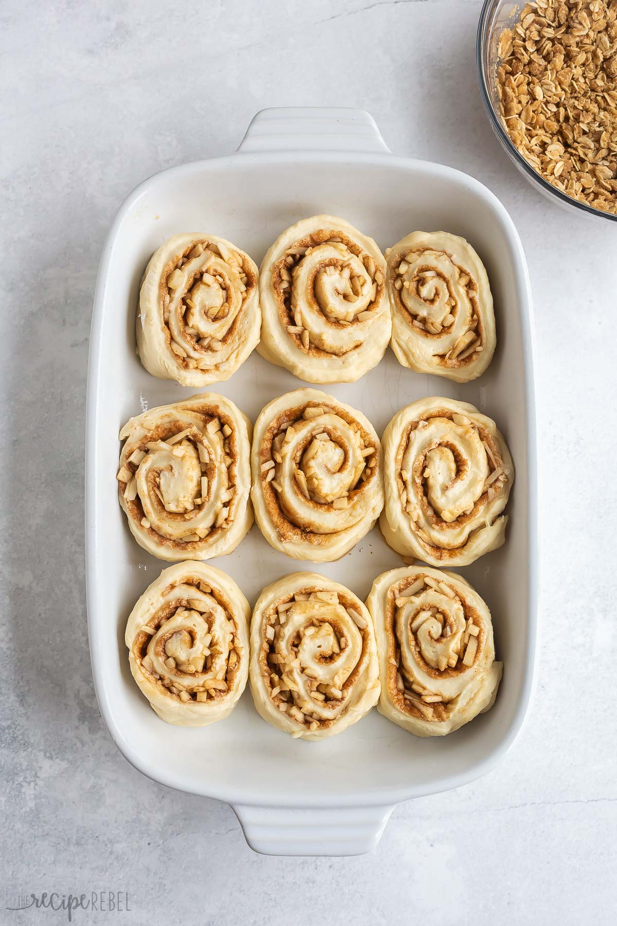 apple cinnamon buns in pan before rising.