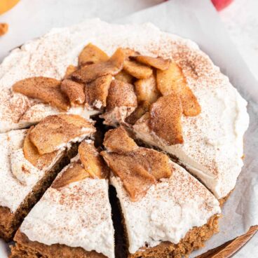 apple spice cake with three slices cut.
