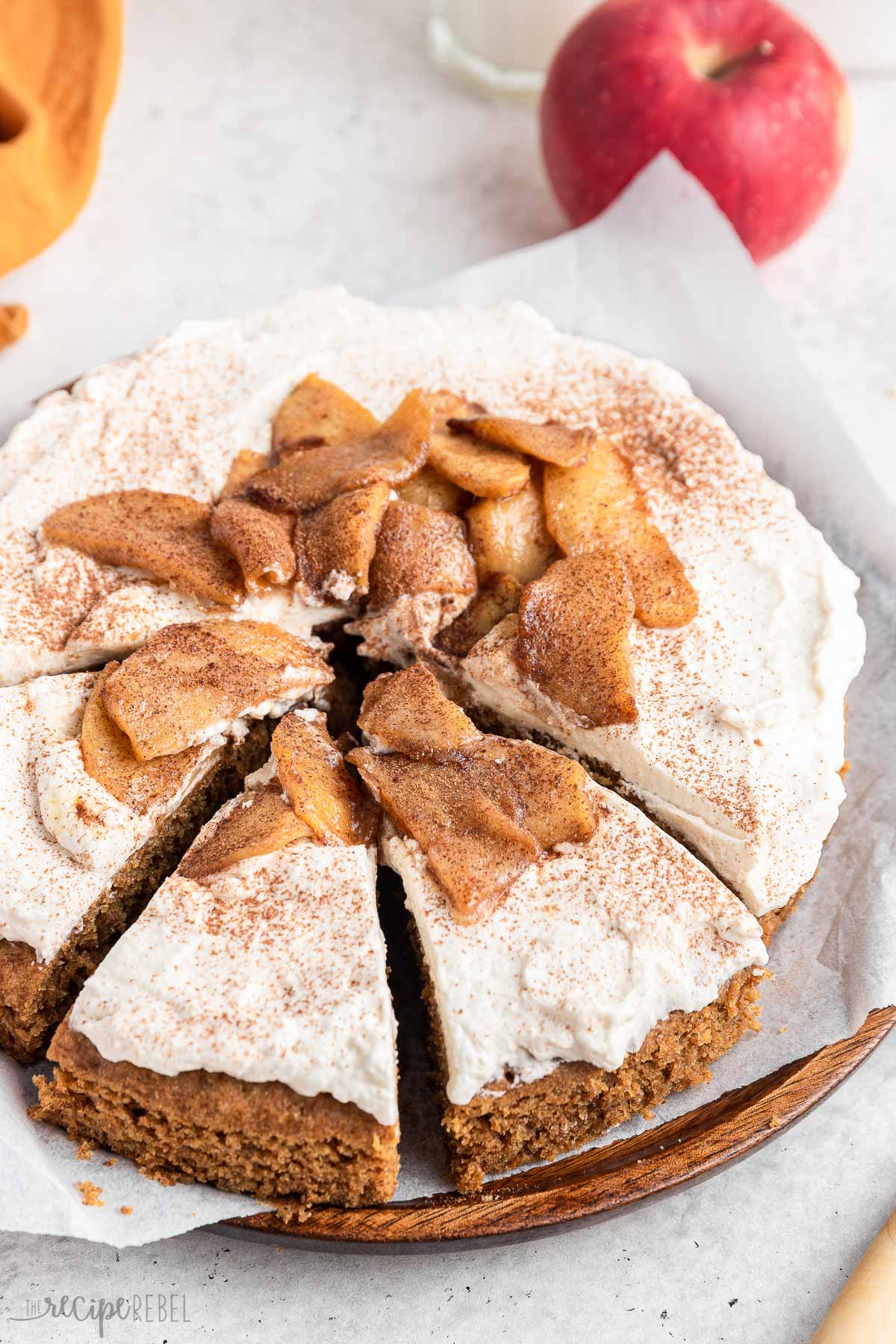 apple spice cake with three slices cut.