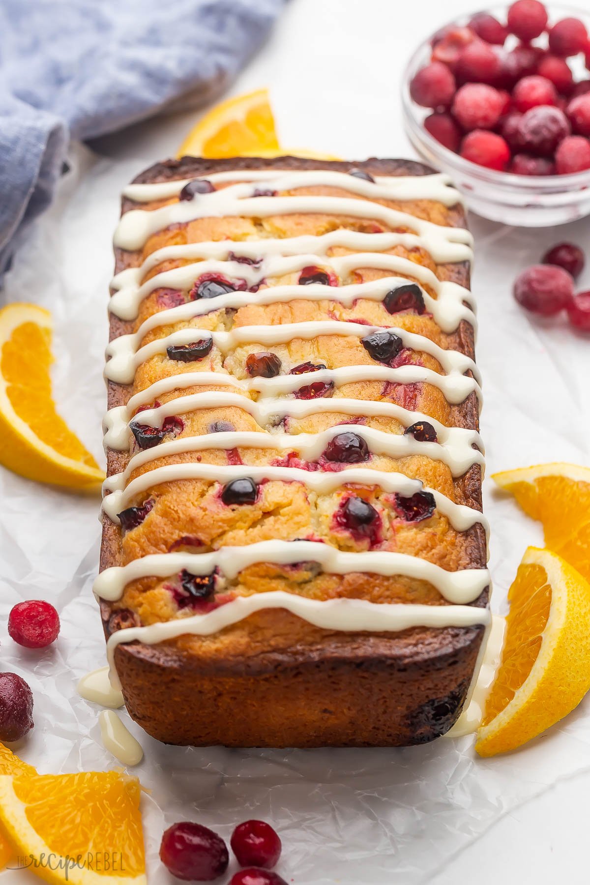 whole orange cranberry bread drizzle with orange glaze.