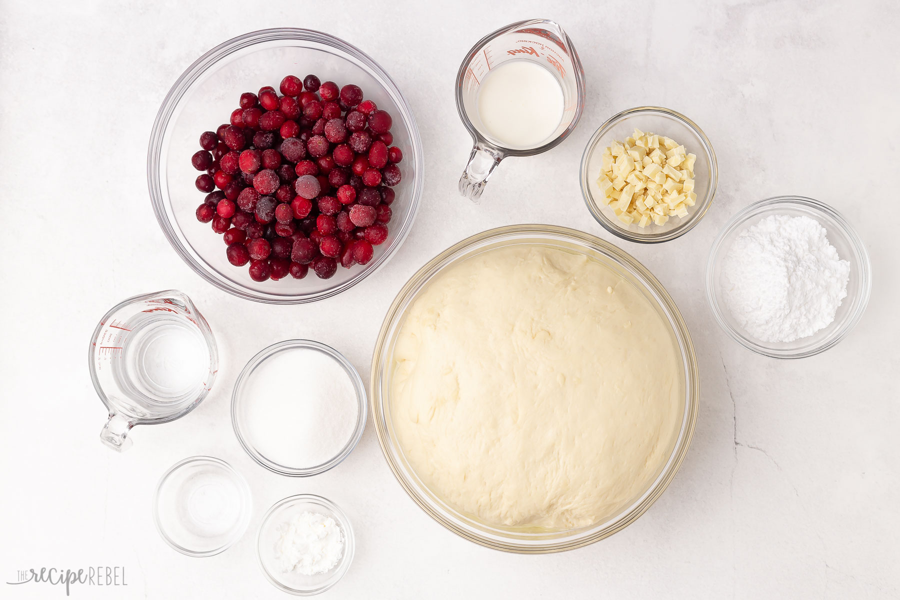 ingredients needed for cranberry sweet rolls on white background.