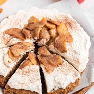 apple spice cake with three slices cut.