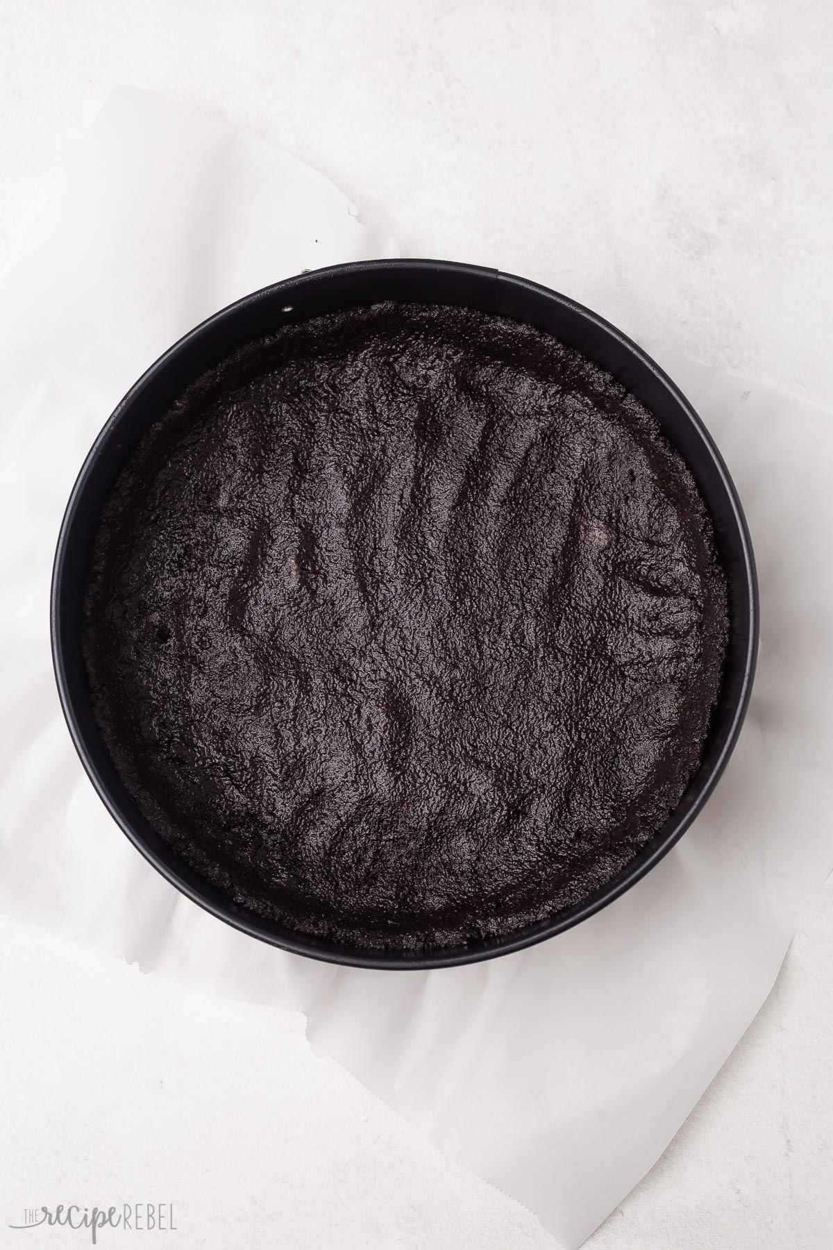 oreo crust in black springform pan.